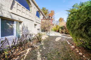 View of side of property featuring brick siding