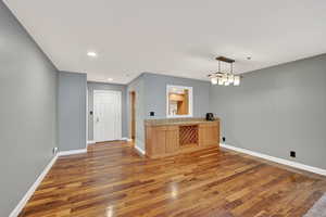 Unfurnished room featuring wood finished floors and recessed lighting