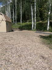 View of yard featuring a storage shed
