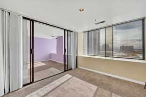 Unfurnished bedroom with carpet and a closet