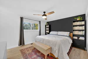 Bedroom featuring a ceiling fan and light wood-style floors