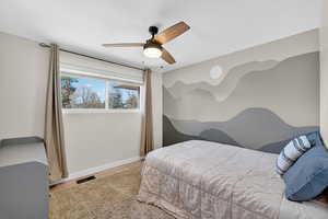 Bedroom featuring light wood finished floors and a ceiling fan