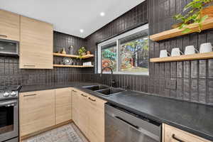 Kitchen featuring open shelves, light brown cabinetry, appliances with stainless steel finishes, and recessed lighting