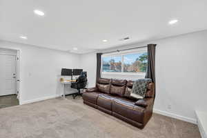 Office area featuring carpet floors and recessed lighting