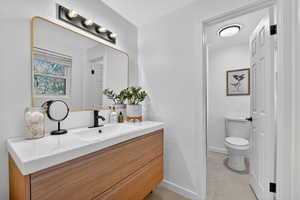 Bathroom with vanity and light tile patterned floors