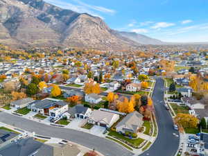 Aerial perspective of suburban area with a mountain backdrop