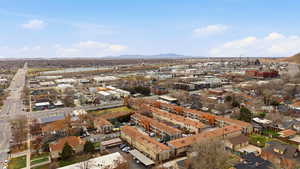 Aerial view of property's location featuring a mountain backdrop