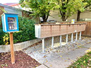 View of property's community with mail area with a small library