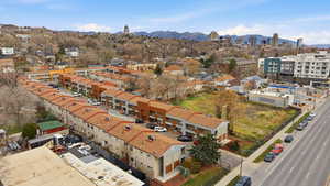 Drone / aerial view of mountains and apartment complex