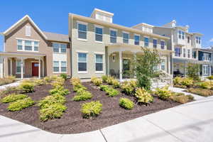 View of front of property featuring covered porch and stucco siding