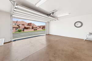 Garage featuring a residential view and a garage door opener