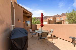 View of patio / terrace featuring a grill, a mountain view, and outdoor dining area