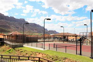 View of tennis court featuring a mountain view