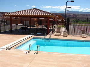 Community pool featuring a patio, a gazebo, and a mountain view