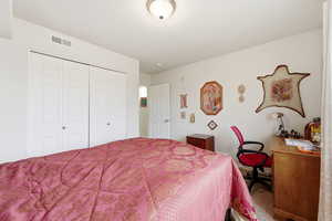 Bedroom featuring a closet and carpet flooring