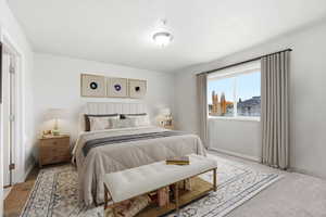 Carpeted bedroom featuring baseboards