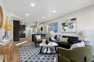 Living room featuring light wood-style floors and recessed lighting