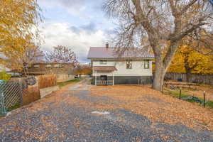 View of front of house with a metal roof
