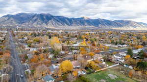 Aerial view of residential area featuring a mountainous background
