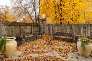 Fenced backyard featuring a vegetable garden