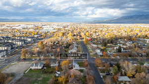 Aerial perspective of suburban area featuring a mountain backdrop