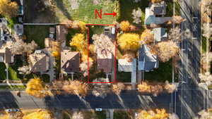 Aerial view of residential area featuring property boundaries highlighted