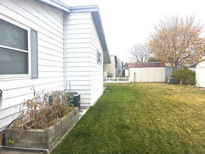 View of yard with a shed