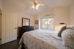 Bedroom with dark wood floors and ceiling fan