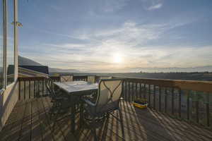 Wooden terrace with a mountain view and outdoor dining space