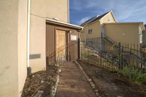 View of side of home with stucco siding
