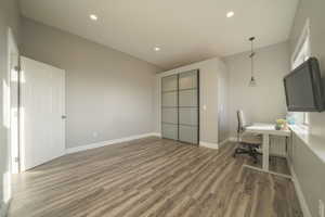 Office space with recessed lighting and wood finished floors
