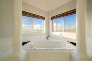 Full bathroom featuring a jetted tub