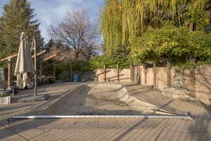 Wooden deck featuring a fenced backyard