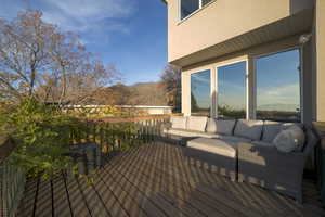 Wooden terrace with a mountain view and outdoor lounge area