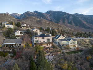 View of mountain backdrop featuring nearby suburban area