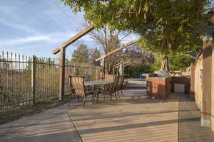 View of patio featuring area for grilling and outdoor dining space