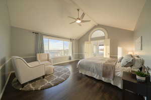 Bedroom with wood finished floors, high vaulted ceiling, a ceiling fan, and beam ceiling