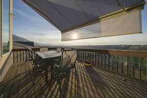 Deck featuring a mountain view and outdoor dining area