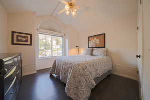 Bedroom featuring dark wood flooring and ceiling fan