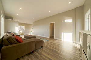 Living room featuring recessed lighting and light wood-style flooring