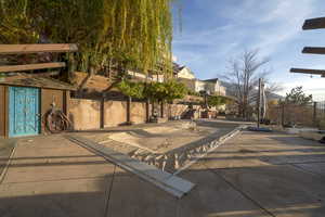 View of patio with a residential view and stairway