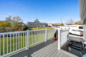 Deck with a residential view and a fenced backyard
