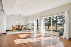 Dining space featuring wood finished floors and recessed lighting