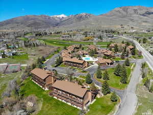 Aerial overview of property's location with mountains and nearby suburban area