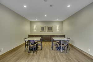 Dining area featuring recessed lighting and light wood-type flooring