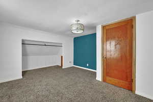 Unfurnished bedroom with carpet floors