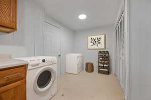 Virtually staged laundry with door (walk-out) to backyard
