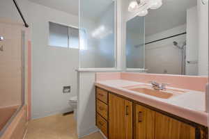 Full bath featuring vanity and shower / tub combination