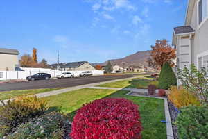 View of yard with a mountain view and a residential view