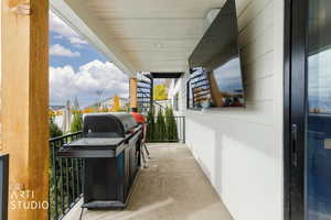 Balcony featuring area for grilling